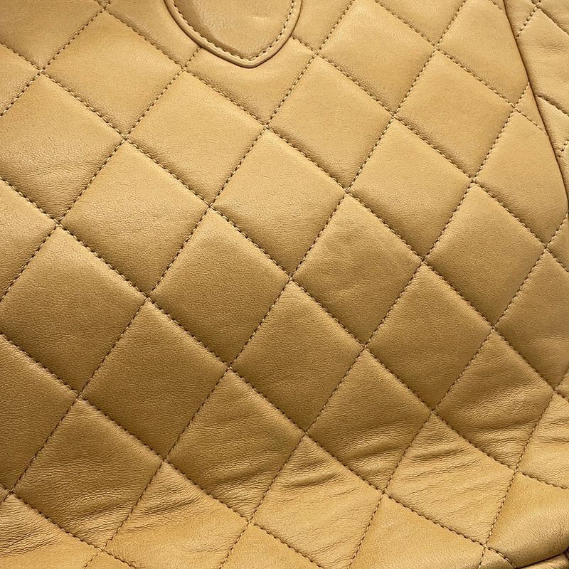 Chanel CC Logo Quilted Chain Lambskin Backpack