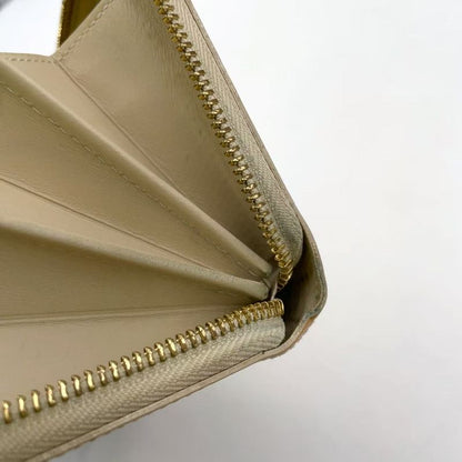 Louis Vuitton Zippy Round Zipper Enamel Leather Yellow Wallet Gold M90142