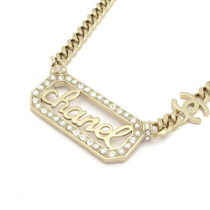 Chanel Necklace - Gold Ivory And Clear Logo Motif