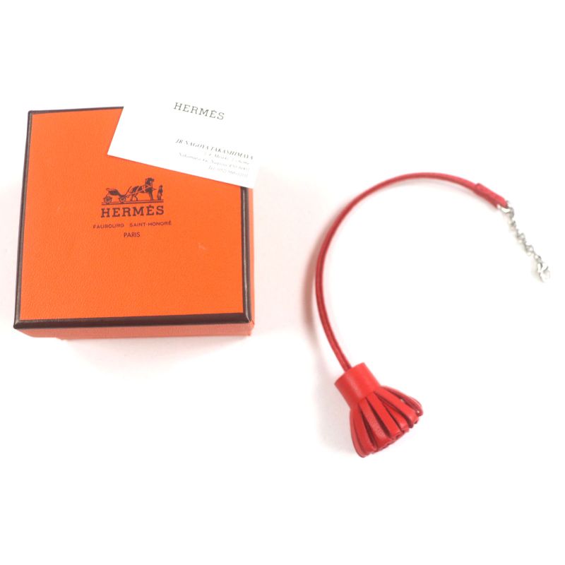 Hermes Carmencita Leather Silver Hardware Pompon Bookmark Bagcharm Orange With