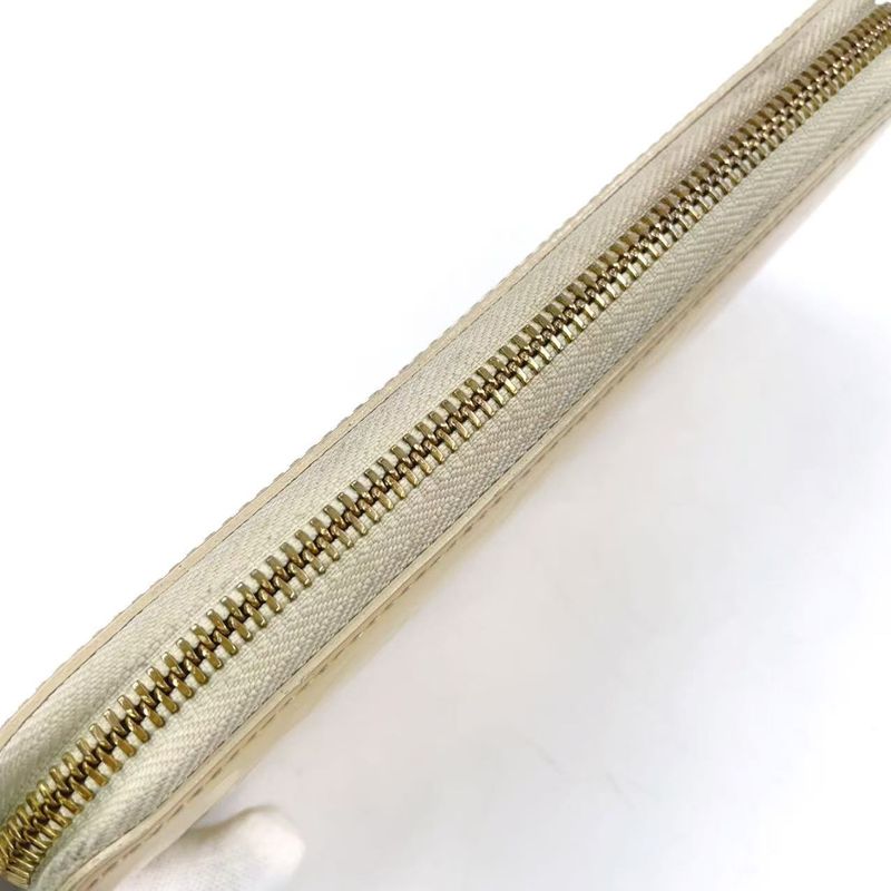 Louis Vuitton Zippy Round Zipper Enamel Leather Yellow Wallet Gold M90142