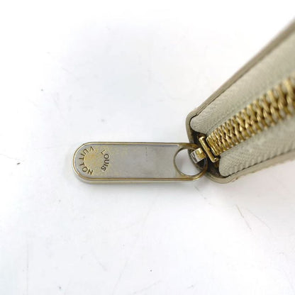 Louis Vuitton Zippy Round Zipper Enamel Leather Yellow Wallet Gold M90142