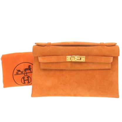 Hermes Pochette Kelly Dobris Orange I Engraved Gold Hardware Clutch Bag