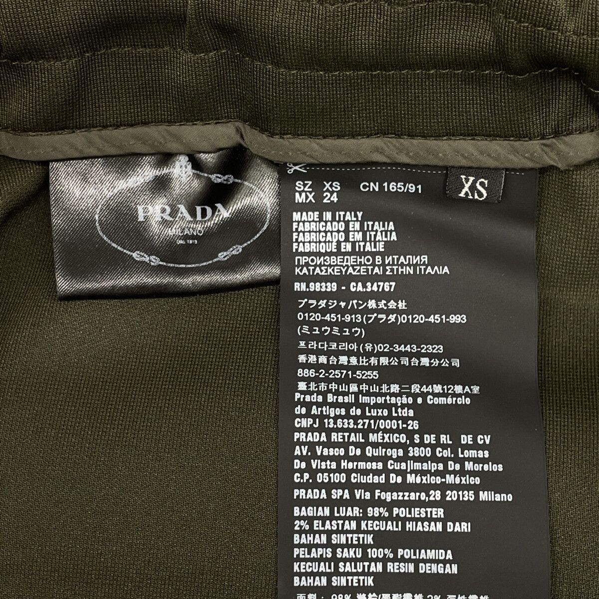 Prada ｶｰｷ ｼﾞｯﾌﾟﾃﾞｻﾞｲﾝ ﾃｰﾊﾟｰﾄﾞﾊﾟﾝﾂ Ｘｓ