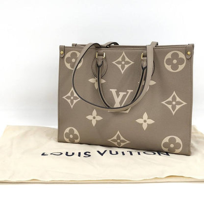 Louis Vuitton On The Go MM 2-Way Handbag Bicolor Monogram Empreinte Tourtrail