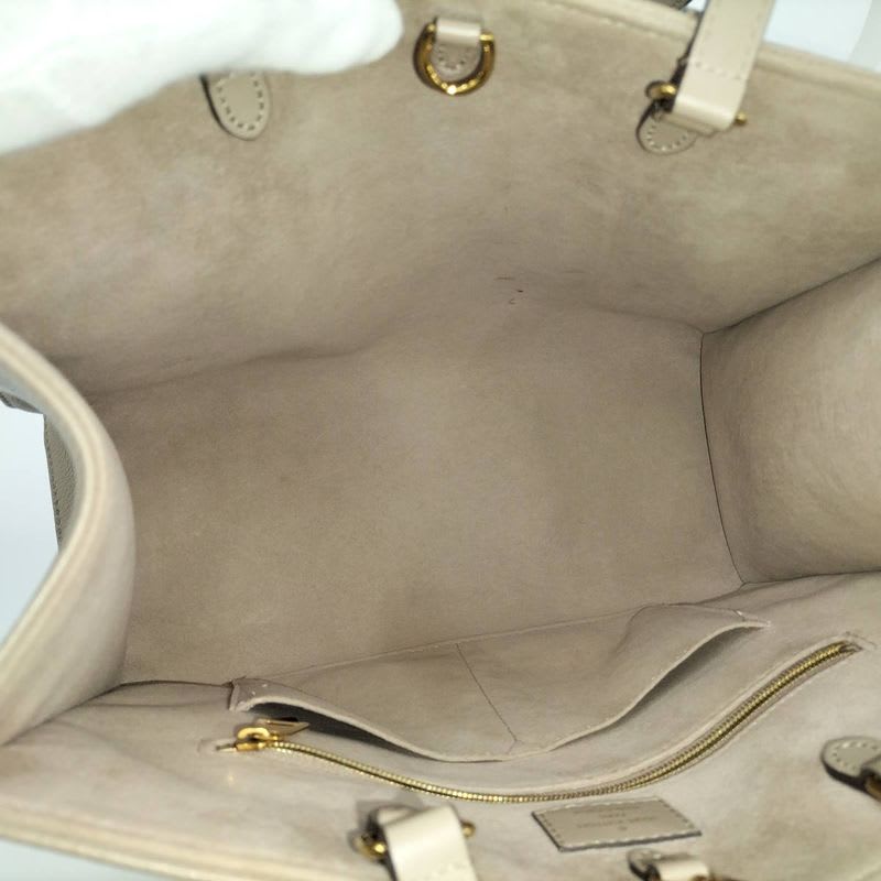 Louis Vuitton On The Go MM 2-Way Handbag Bicolor Monogram Empreinte Tourtrail