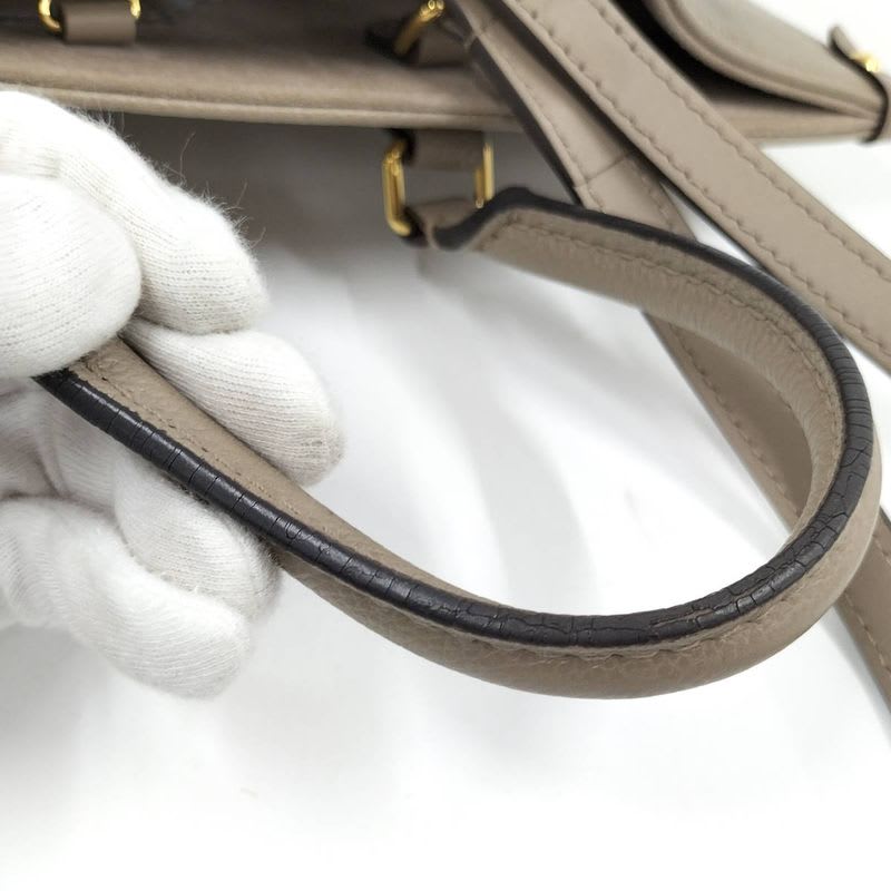 Louis Vuitton On The Go MM 2-Way Handbag Bicolor Monogram Empreinte Tourtrail