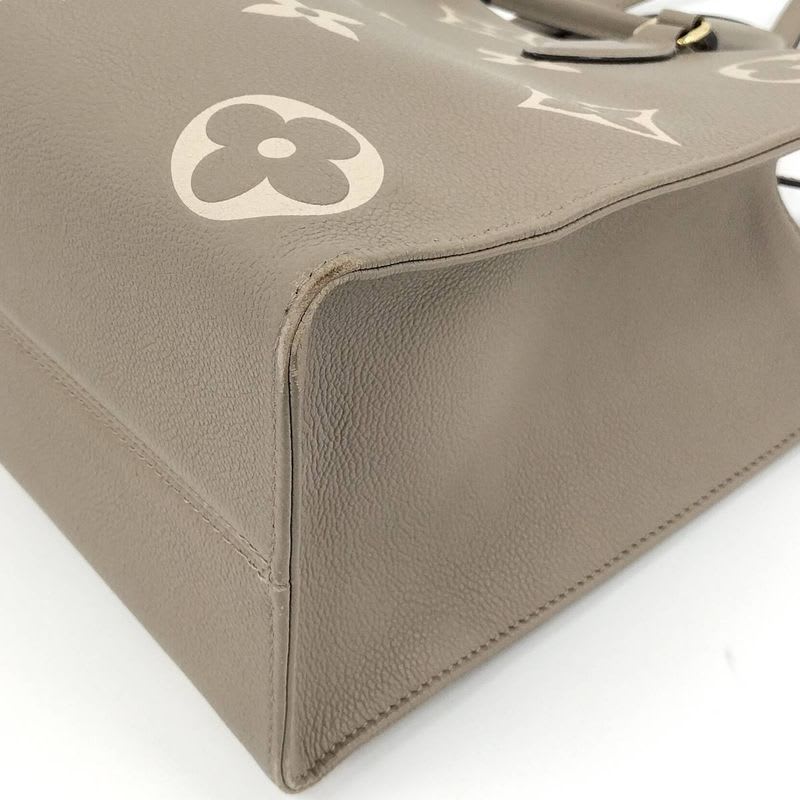 Louis Vuitton On The Go MM 2-Way Handbag Bicolor Monogram Empreinte Tourtrail