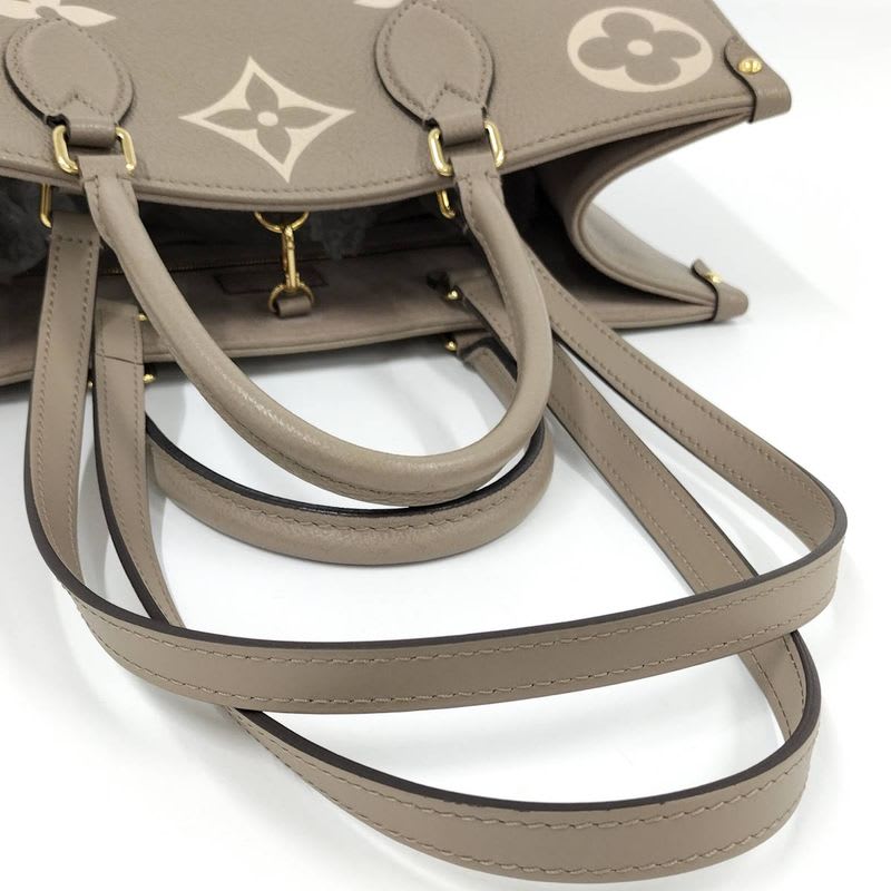 Louis Vuitton On The Go MM 2-Way Handbag Bicolor Monogram Empreinte Tourtrail
