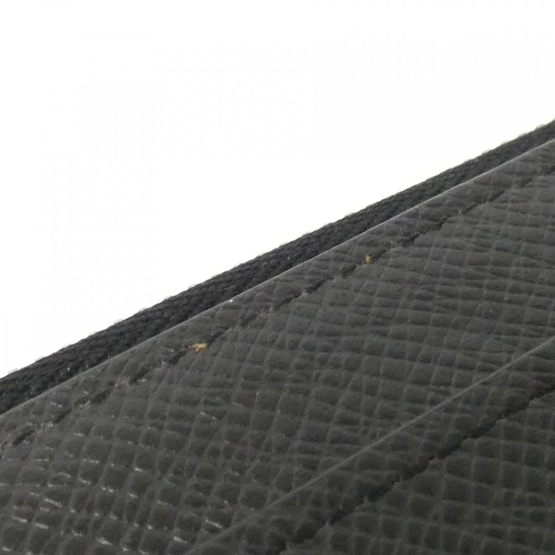 Louis Vuitton Taiga Zippy Dragonne Wallet