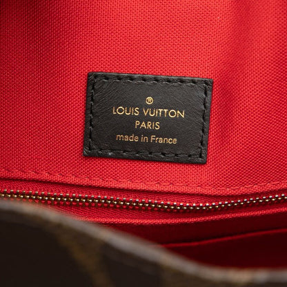 Louis Vuitton Monogram Giant Reverse on the Go MM Shoulder Bag