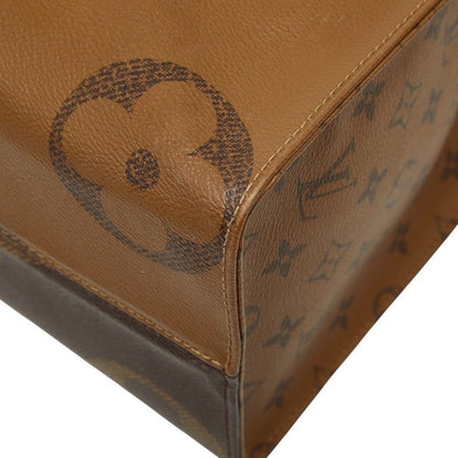Louis Vuitton Monogram Giant Reverse on the Go MM Shoulder Bag