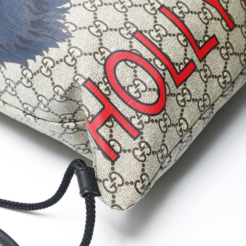 Gucci GG Supreme Drawstring Wolf Backpack