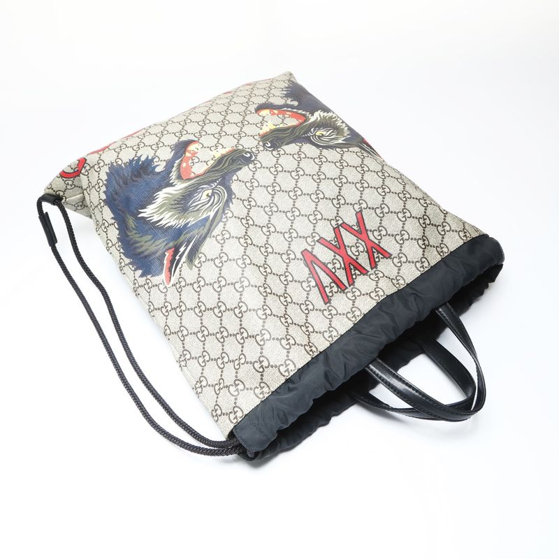 Gucci GG Supreme Drawstring Wolf Backpack
