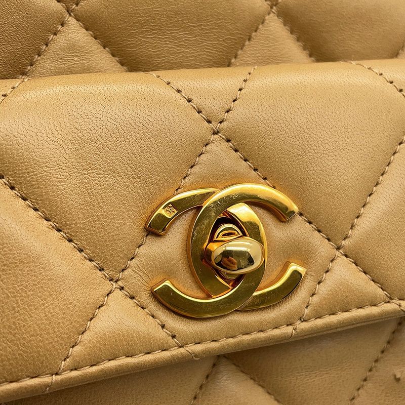 Chanel CC Logo Quilted Chain Lambskin Backpack