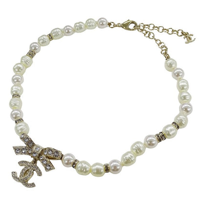 Chanel Choker Necklace Metal Line Stone Faux Pearl Ribbon CC Logo Gold White