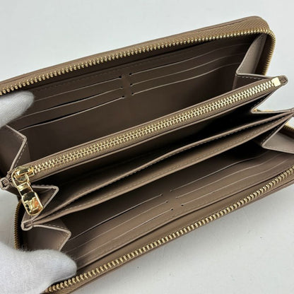 Louis Vuitton Zippy Wallet Coussin Embossed Monogram Leather Taupe