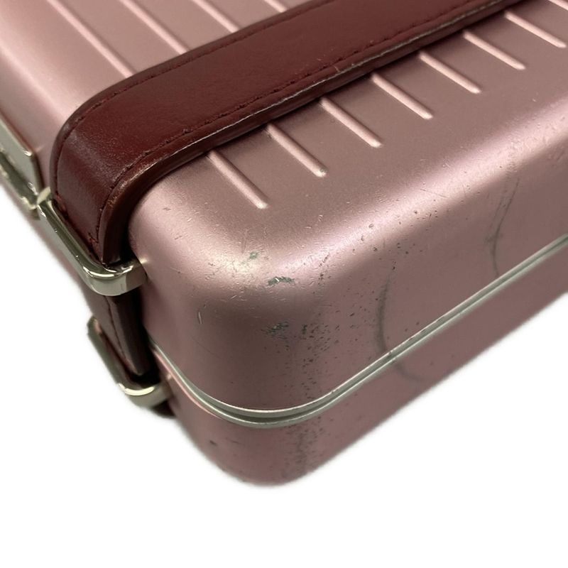 Dior Clutch and Rimowa Personal Pink Gold Collaboration