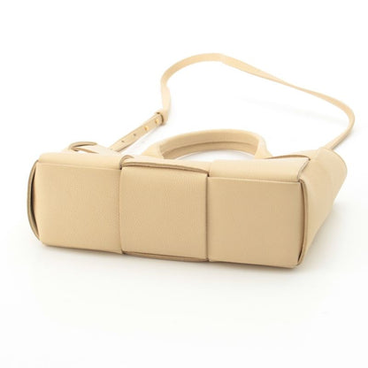 Bottega Veneta Leather Maxi Intrecciato Mini Arco 2-Way Handbag Beige