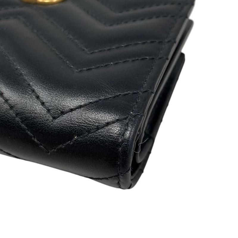 Gucci Bifold Wallet Double Quilted Leather Logo Black Gold