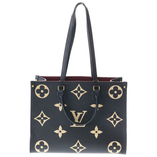 Louis Vuitton On The Go MM Monogram Empreinte Bicolor Leather Hand Tote Gold