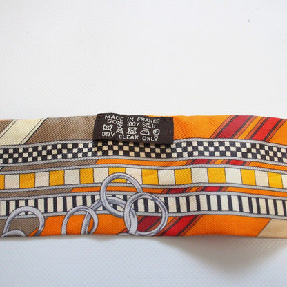 Hermes Twilly Bridle and Charm Silk 100% Orange Pawn Scarf — view 7