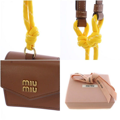 Miu Miu Miu Trick Mini Pouch Charm Airpods Case Leather Brown Yellow TK — view 9