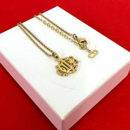 Dior Vintage Logo Pendant Gold