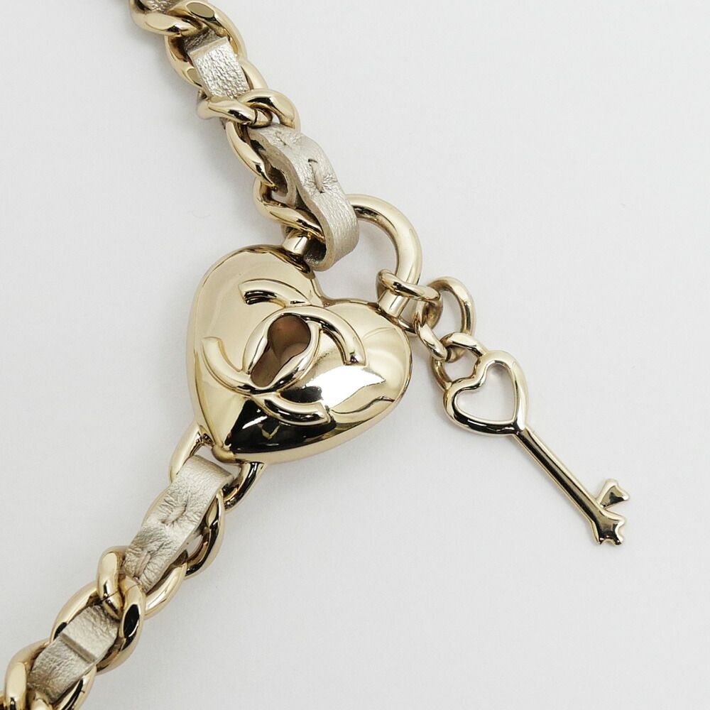 Chanel Quilted Mini Clutch Heart Charm Champagne Gold Chain — view 7