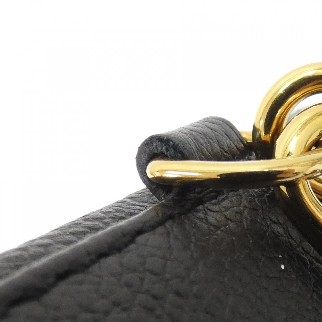 Louis Vuitton Monogram Empreinte Tiny Backpack — view 4