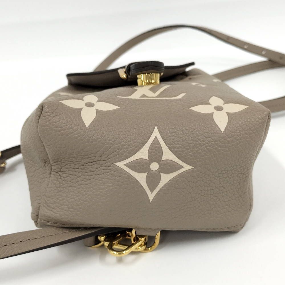 Louis Vuitton Tiny Backpack Monogram Empreinte Beige — view 5