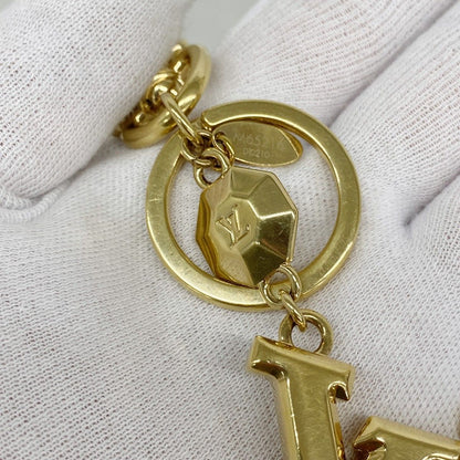 Louis Vuitton Key Holder Charm LV Facet Gold — view 5