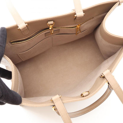 Louis Vuitton Tote On The Go MM Monogram Empreinte Tourterelle 2-Way Leather — view 3