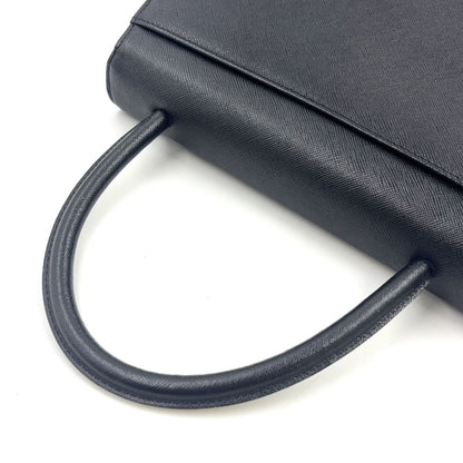 Saint Laurent Logo Embossed Leather Black Handbag Gold — view 6