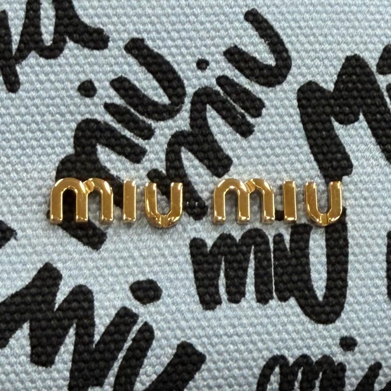 Miu Miu Canvas Logo All Over Print Bird Motif Drawstring Bag Light Blue Black — view 8