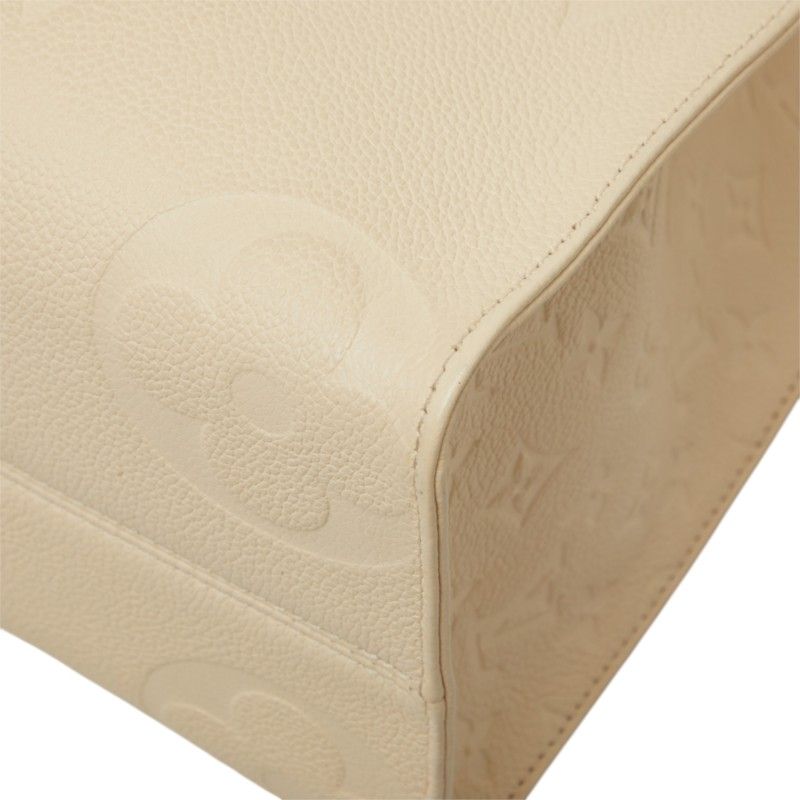 Louis Vuitton Monogram Empreinte on the Go MM Shoulder Bag Cream Ivory Leather — view 4