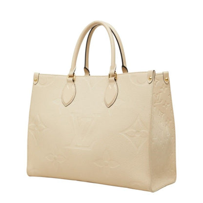 Louis Vuitton Monogram Empreinte on the Go MM Shoulder Bag Cream Ivory Leather — view 2