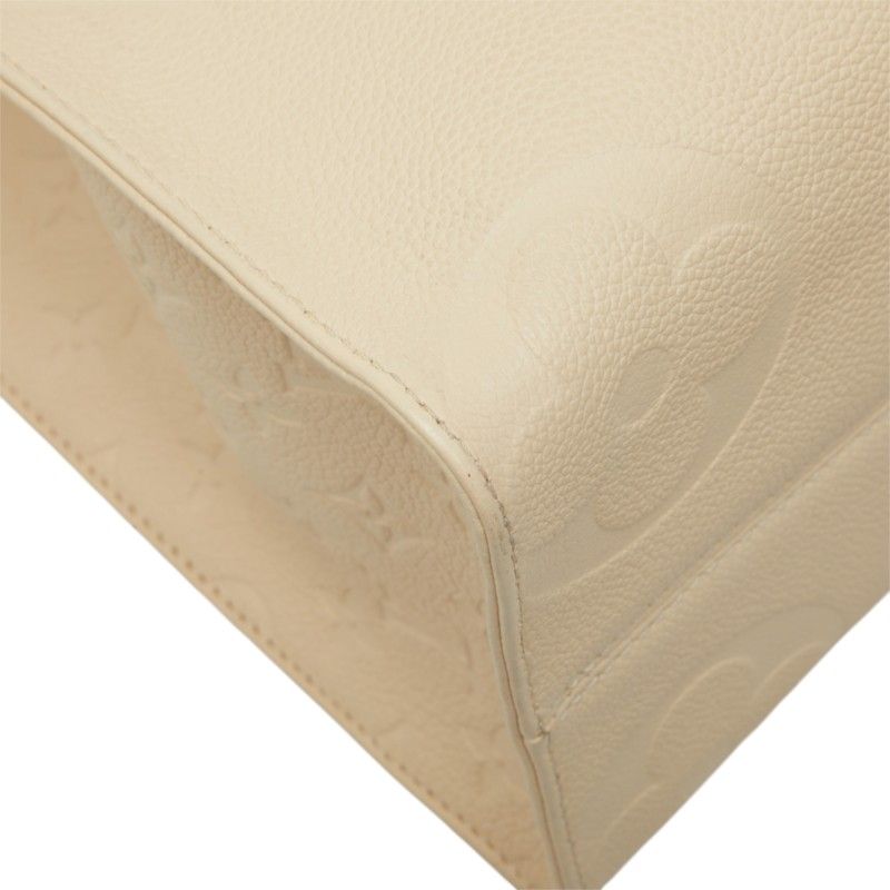 Louis Vuitton Monogram Empreinte on the Go MM Shoulder Bag Cream Ivory Leather — view 7