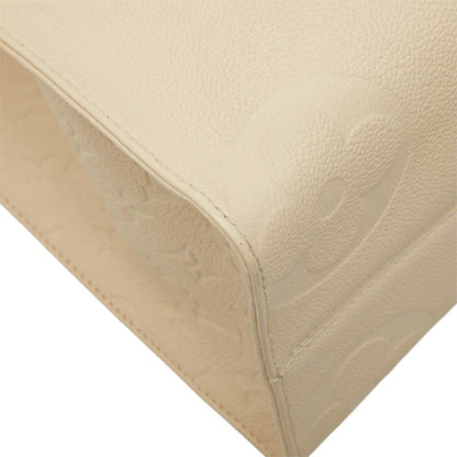 Louis Vuitton Monogram Empreinte on the Go MM Shoulder Bag Cream Ivory Leather — view 7
