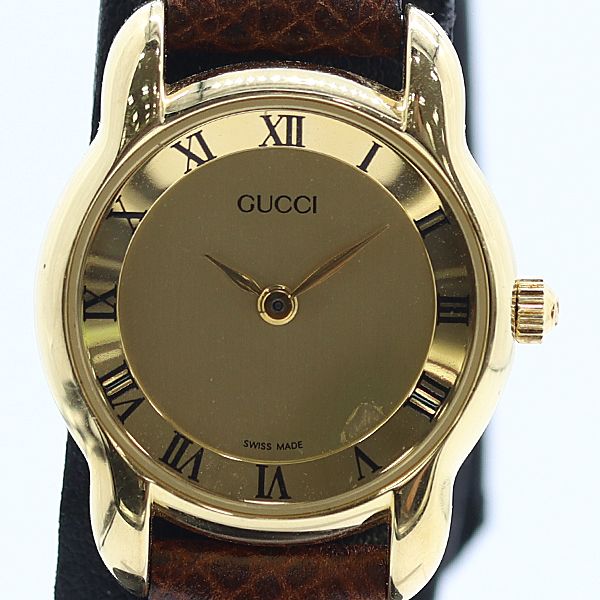 Gucci Round Gold Dial Watch