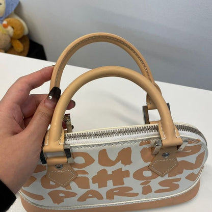 Louis Vuitton Alma Oriental Handbag