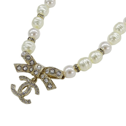 Chanel Choker Necklace Metal Line Stone Faux Pearl Ribbon CC Logo Gold White