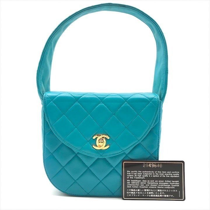 Chanel CC Logo Turnlock Quilted Lambskin Mini Hand Vanity Bag Blue