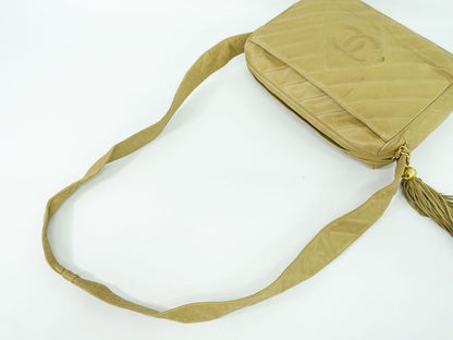 Authentic Chanel Coco Mark Tassel Shoulder Bag Pochette Lambskin Leather Beige