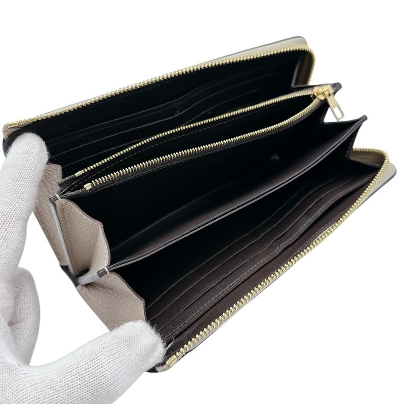 Louis Vuitton M63104 Taurillon Leather L-shape Portefeuille Comete Long Wallet