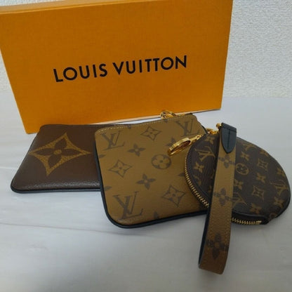 Louis Vuitton Pochette Trio Monogram Pouch