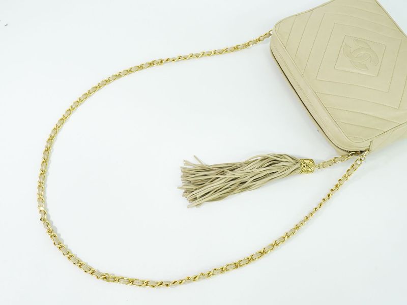 Authentic Chanel Coco Mark Tassel Shoulder Bag Pochette Lambskin Leather Beige