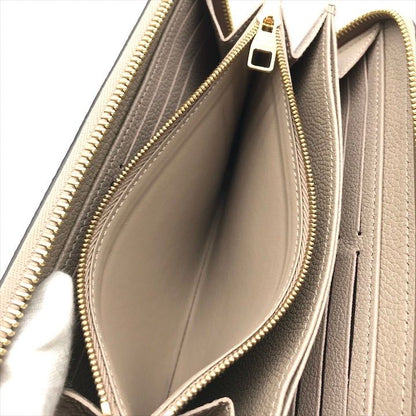 Louis Vuitton Empreinte Zippy Wallet Beige