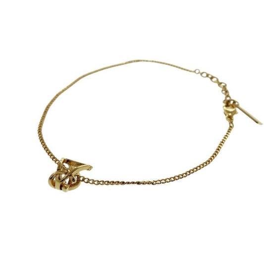 Yves Saint Laurent Opium Monogram Twisted Cassandra Bracelet GP Gold
