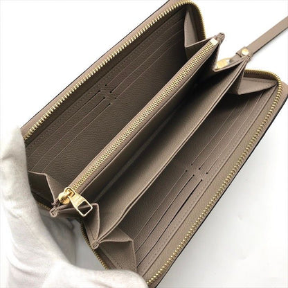 Louis Vuitton Empreinte Zippy Wallet Beige